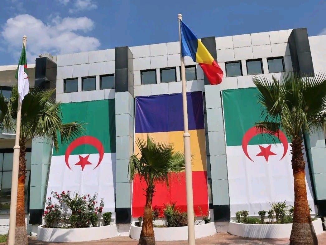 Chad and Algeria leaders shaking hands with African flags in background