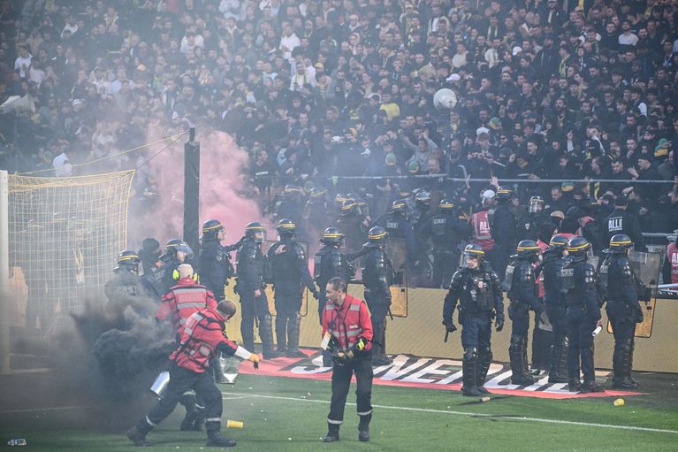 Fans return to stands as security personnel attempt to restore order