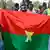 Supporters of the Alliance of Sahel States waving a handmade Burkina Faso flag (January 2024 archive)