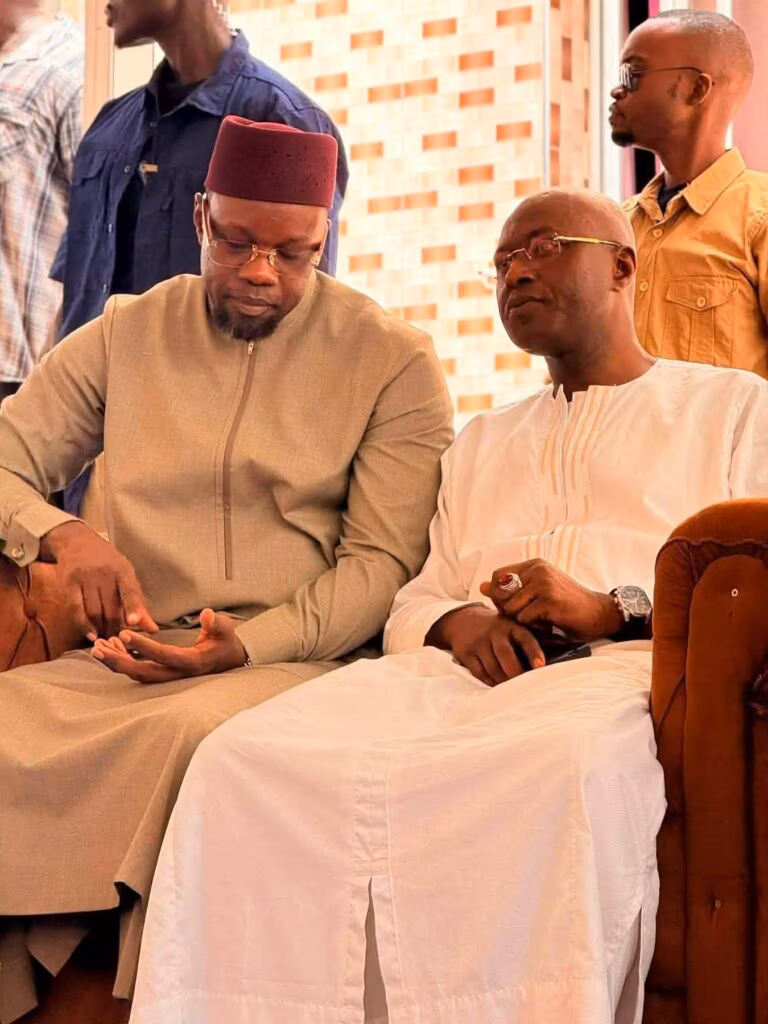 Ousmane Sonko with Diamil Sané family during condolence visit