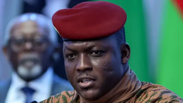 Close-up of Ibrahim Traoré in military attire with red beret