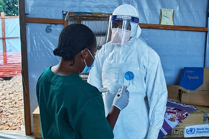 Healthcare workers discuss patient care at Bunia Evangelical Medical Center in early July